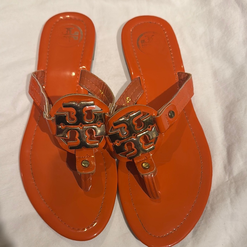 Tory Burch Orange Sandals with Medallion Embellishments